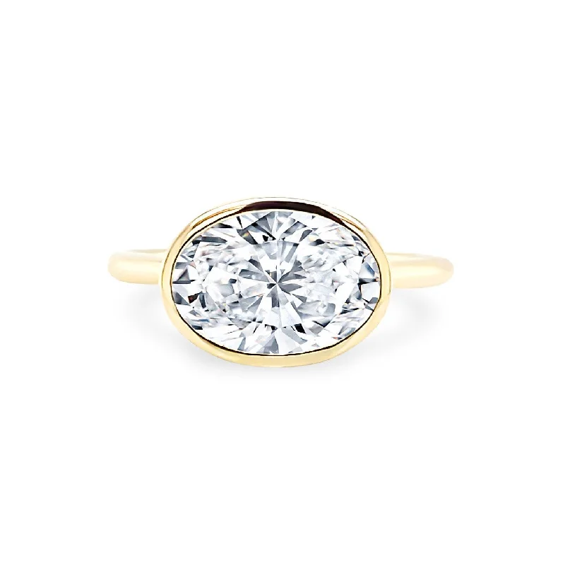 women’s rings with cushion-cut diamonds-East West Bezel Set Oval Cut Solitaire