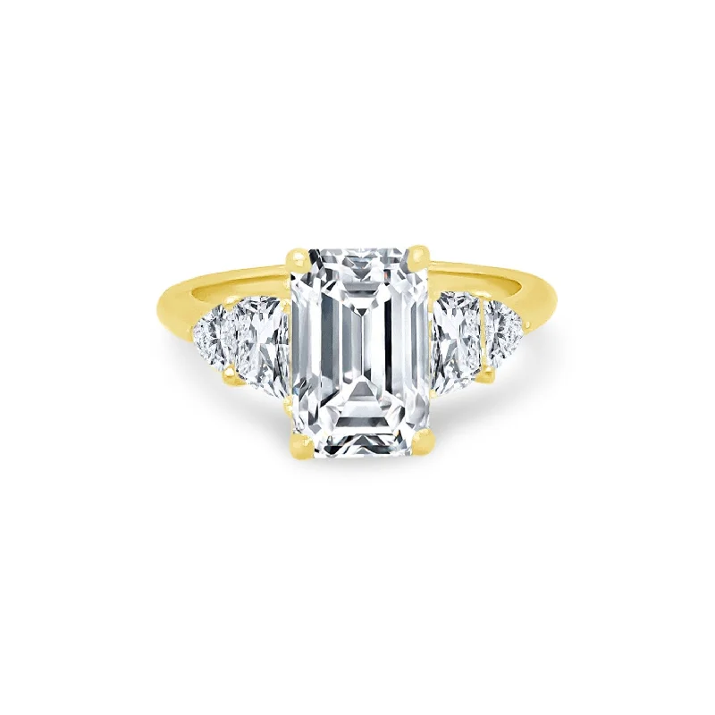 modern women’s engagement rings-Emerald Cut Diamond with Trapezoid and Trillion Side Stones