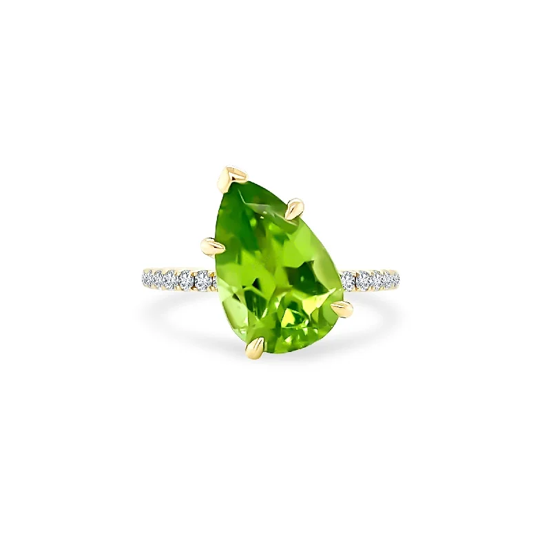 women’s promise rings with engravings-Offset Pear Cut Peridot Solitaire on Diamond Band